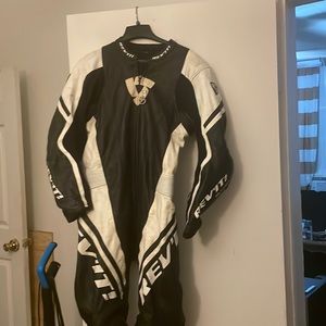 REV’IT full body racing suit. Knee and elbow pads sewn in. No rips or tears.